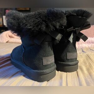 Women’s black mini Bailey bow uggs